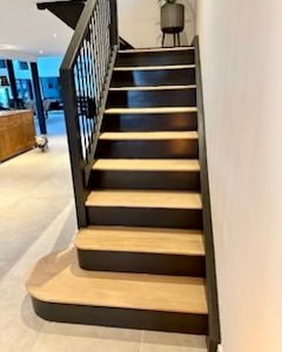 black spindles with painted pine handrails